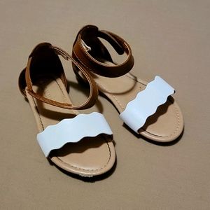 Brown and white sandals